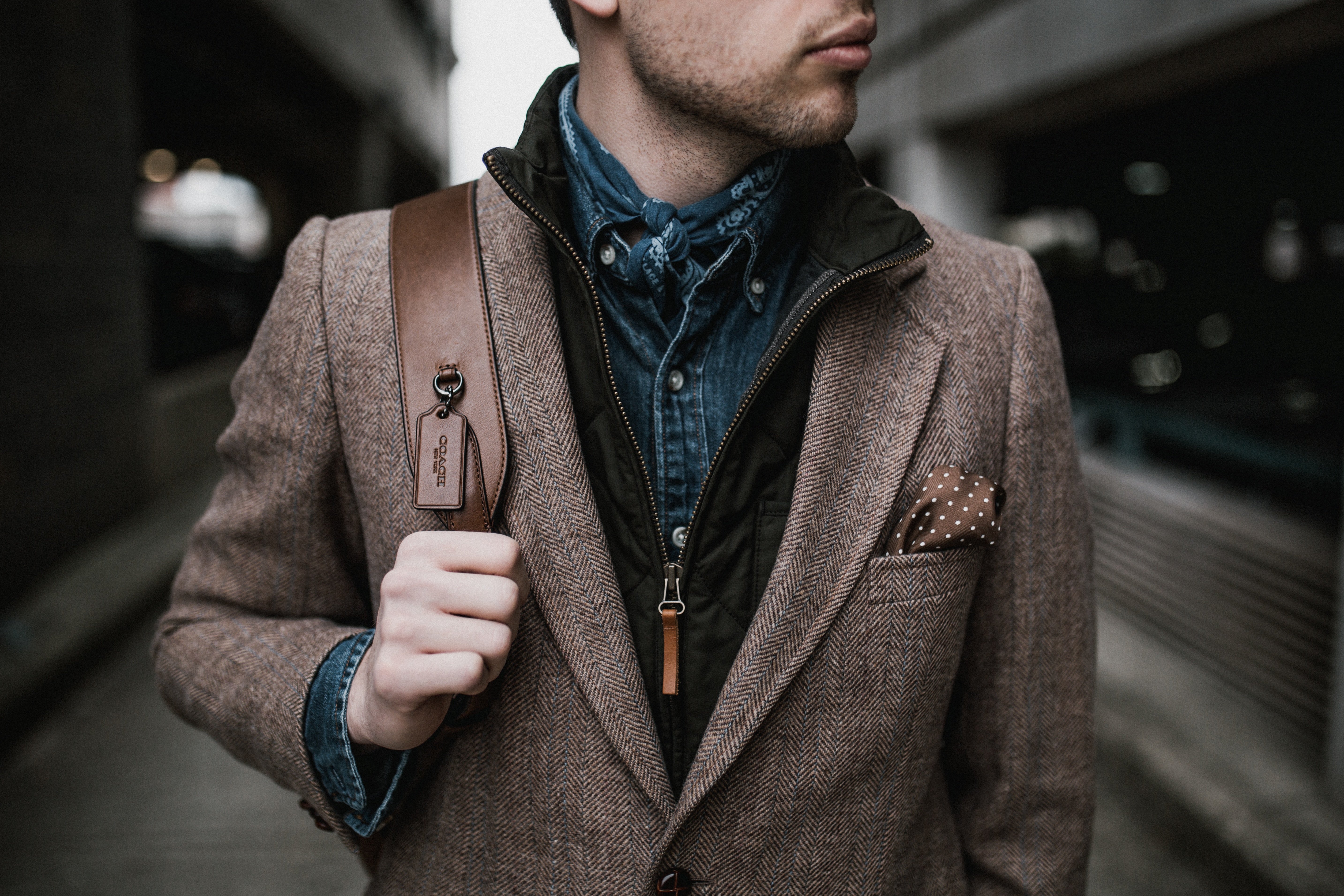 a person wearing a brown jacket